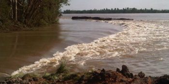 Water breaching levee