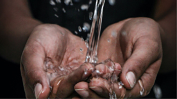Water falling into cupped hands