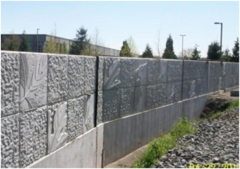 The King County Flood Control District, together with the cities of Kent and Tukwila, are choosing floodwalls and rip-rap bank armoring instead of sustainable levee designs that provide room for trees to shade the river. Image: Floodwall on Boeing Levee, completed 2013. | City of Kent, WA