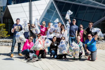 Volunteers with the 17th Annual Earth Day Charles River Cleanup showing off their finds. | Katie Friedman