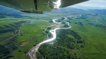 Yampa River meanders through Yampa Valley agricultural fields en route to Dinosaur National Monument and the Green River. | Photo: Sinjin Eberle
