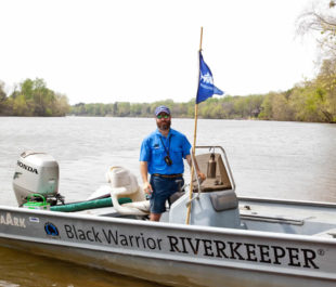 Black Warrior Riverkeeper Nelson Brooke on in the river in the patrol boat near Tuscaloosa. | Photo by John Wathen, Hurricane Creekkeeper