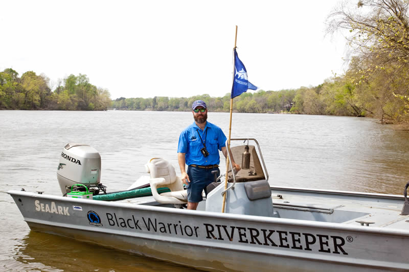 Black Warrior Riverkeeper Nelson Brooke on in the river in the patrol boat near Tuscaloosa. | Photo by John Wathen, Hurricane Creekkeeper