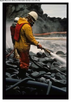 A worker assists in the Exxon Valdez Oil Spill cleanup in the Prince William Sound September 11, 1989. | Photo: ARLIS Reference