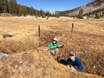 AmeriCorps member Rachel Friesen and American Rivers volunteer Carson Clark measure a large gully as part of a meadow assessment in Kings Canyon National Park. | Maiya Greenwood