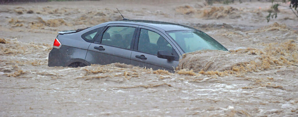 A car is flooded in the Ellicott City, Maryland flooding. | Kenneth K. Lam/Baltimore Sun/TNS via Getty Images