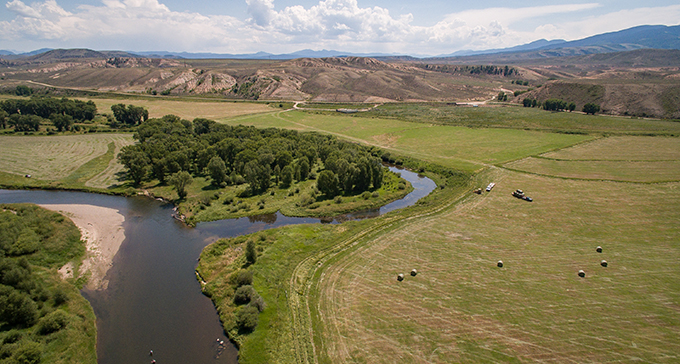 Members of the West Denver Chapter of Trout Unlimited survey the work they've helped to facilitate on the Clear Creek in Jefferson County, Colorado. | J. Duplechian