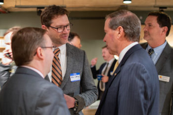 NRS Marketing Director Mark Deming talks with Jim Bradley of American Rivers and Senator Tom Udall.