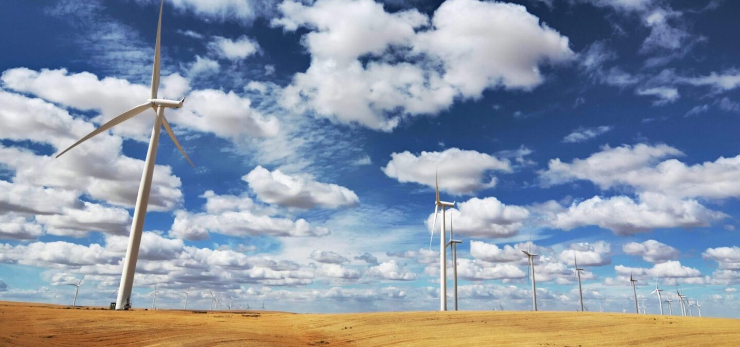 Wind Turbines in Wheat Field | Photo by Daniel Parks