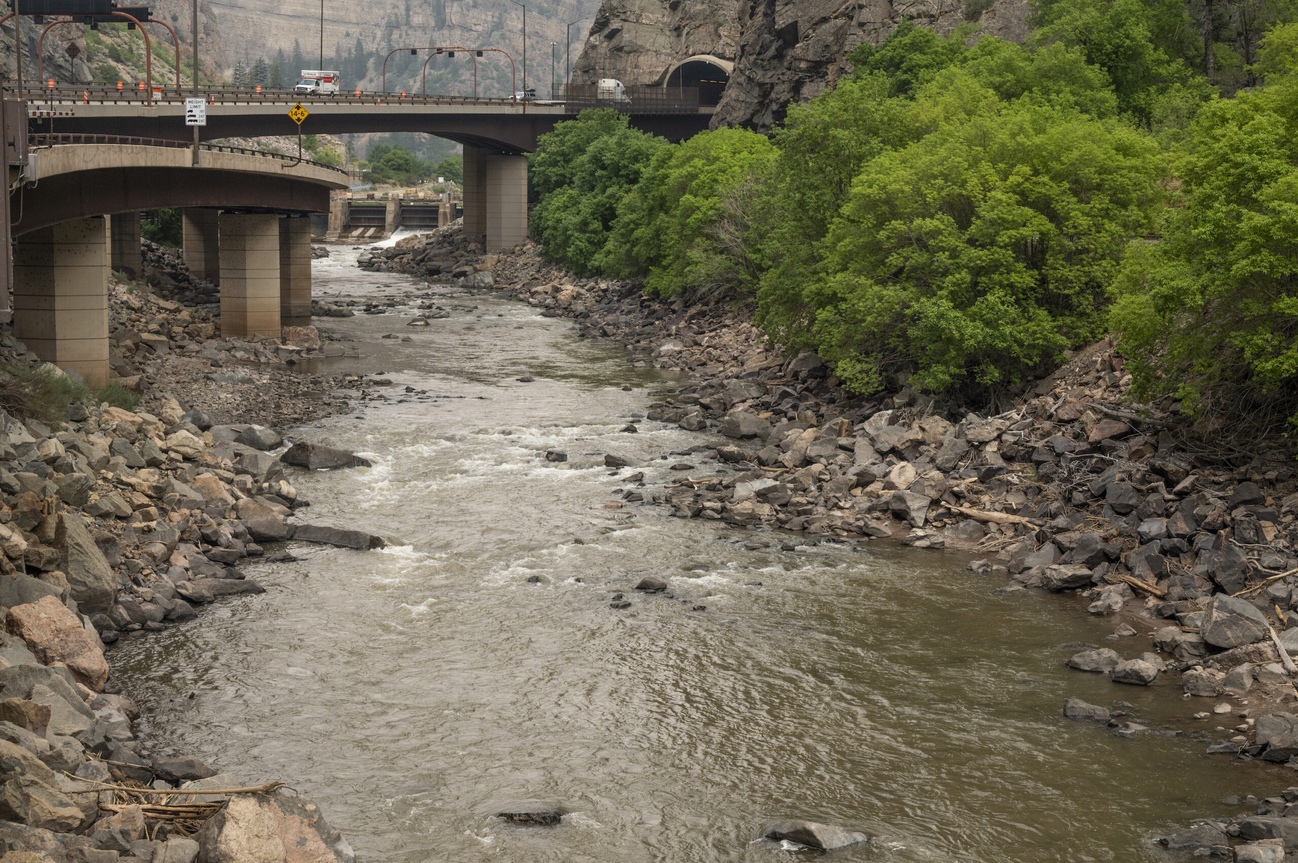 A soiled and sad Colorado River below the dam that holds water for the Shoshone power generating station | Photo by Tim Romano