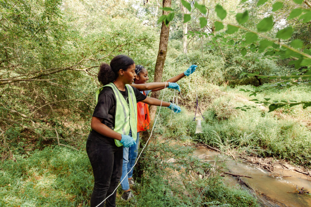 Volunteers collect water samples at the Southside River Rendezvous in Atlanta | Photo Credit Kenny Gamblin