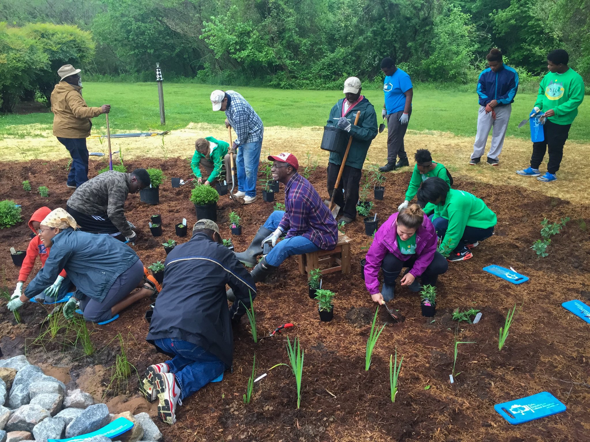 Fellows at St. Ambrose Church helping to plant the new rain garden | Photo by Peter Raabe