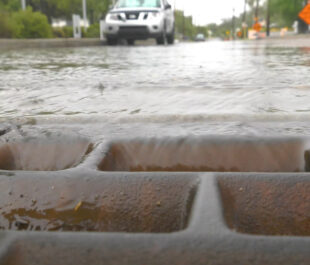 Storm drain during flooding in Tuscan, Arizona | Photo by Sinjin Eberle