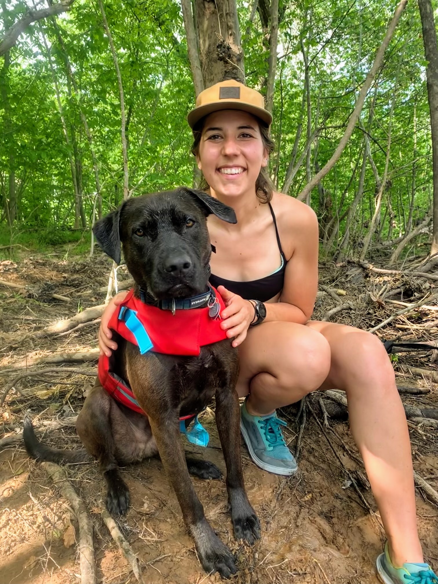 Sophie Stern with her dog, Pinecone, sporting a life vest | Photo by Nathan Salle