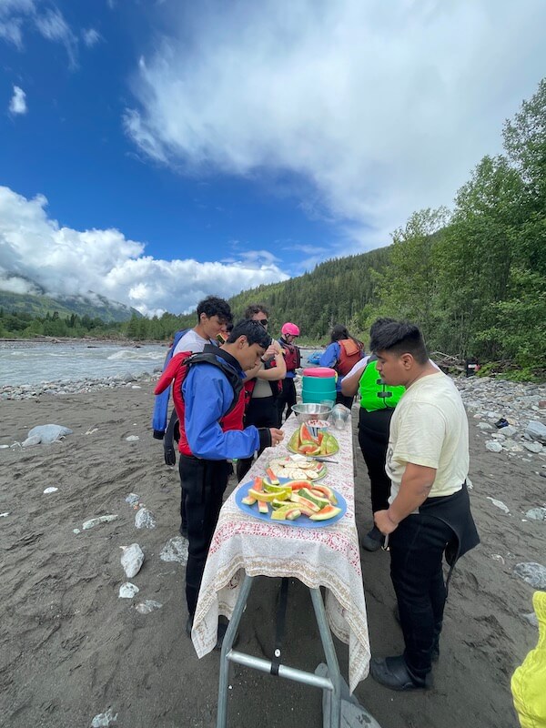 Rafters taking a food break during their trip down the Nooksack River in California || Photo by Bridget Moran