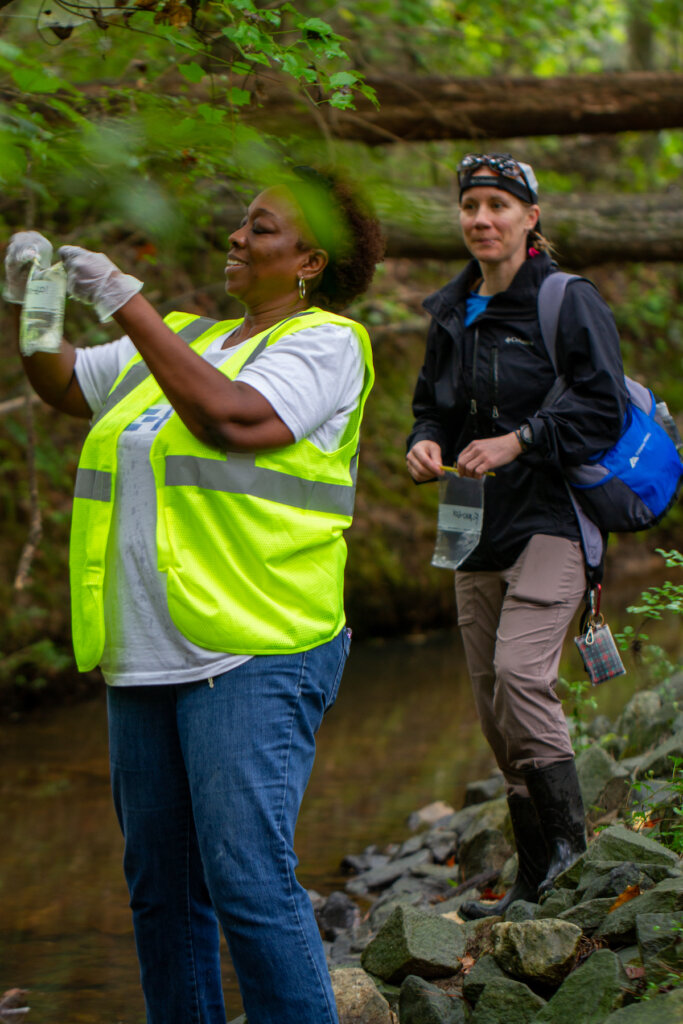 Melinda and Holley picking up trash in Morning Creek - Photo by Danielle Bunch