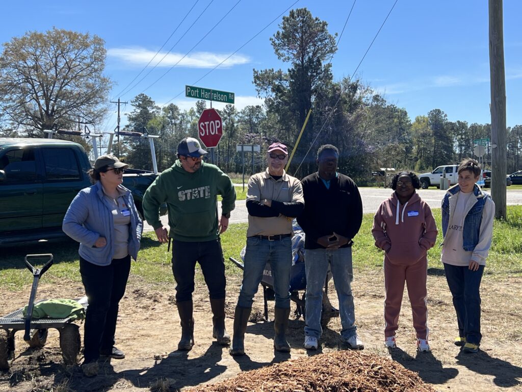 A group of participants from a rain garden installation.